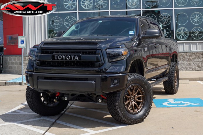 Black 2014 Toyota Tundra with Lift on 20x9 Fuel Off-Road D681 Rebel 5 Wheels in Bronze & 37x12.50R20 BFGoodrich All-Terrain T/A Tires
